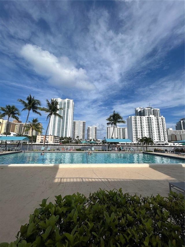 view of pool featuring a city view