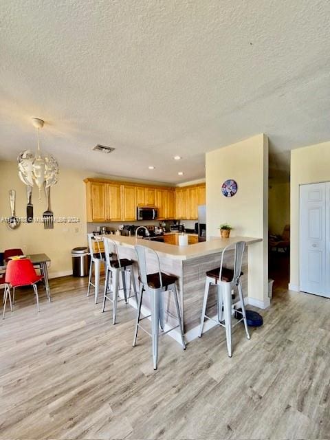 details featuring ceiling fan, sink, and hardwood / wood-style floors