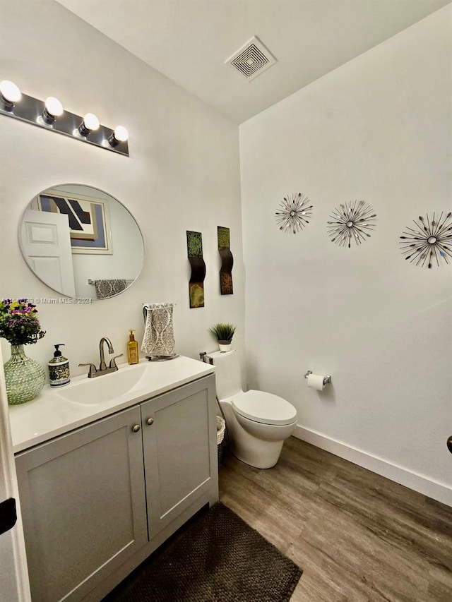 washroom featuring stacked washer and clothes dryer, a textured ceiling, and light wood-type flooring