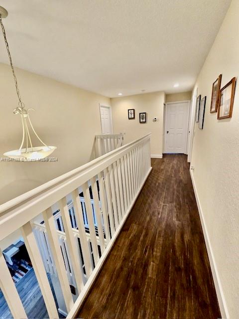 bathroom with toilet, hardwood / wood-style flooring, and vanity