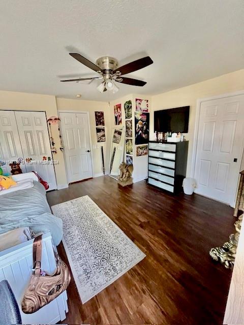 bedroom featuring dark hardwood / wood-style flooring and ceiling fan