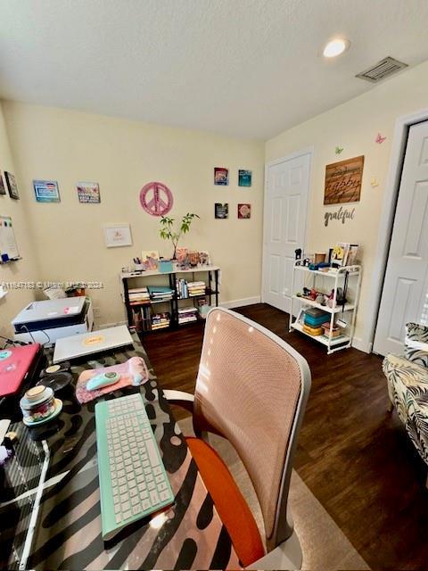 office space featuring dark hardwood / wood-style flooring