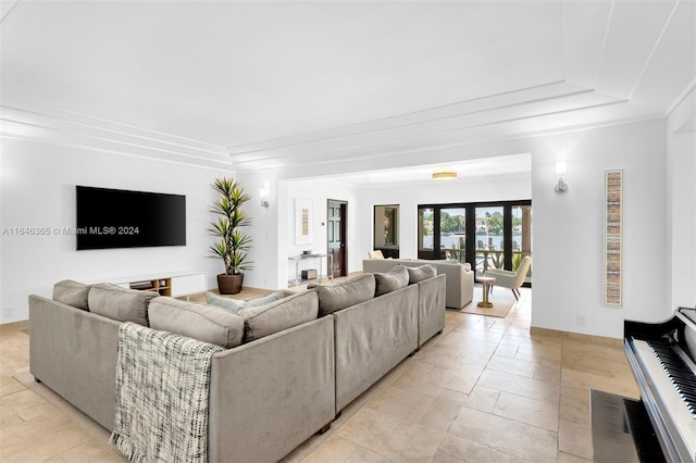 living room featuring french doors and light tile patterned floors