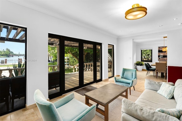 living room with light tile patterned flooring, crown molding, and a water view