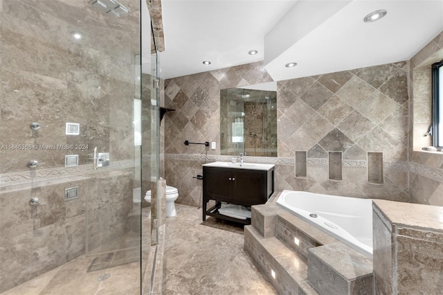 full bathroom with tile walls, plus walk in shower, vanity, and toilet