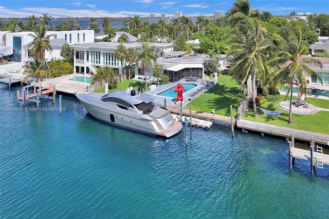 view of dock featuring a water view and a lawn