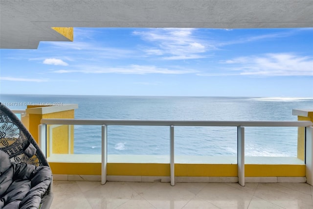 balcony featuring a water view