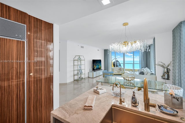 bathroom featuring a notable chandelier