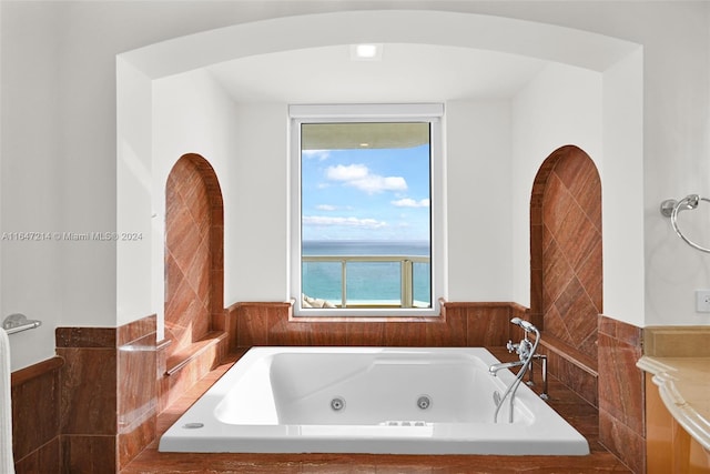 bathroom with tiled tub