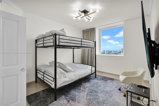 bedroom with ornamental molding and a notable chandelier