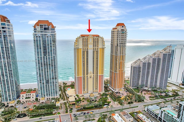 view of city with a view of the beach and a water view