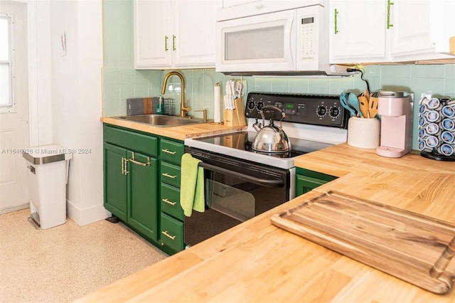 kitchen with white cabinetry, backsplash, sink, and electric range