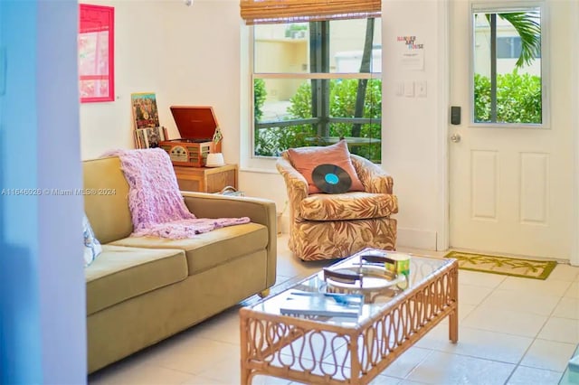 living area with a wealth of natural light and light tile patterned floors