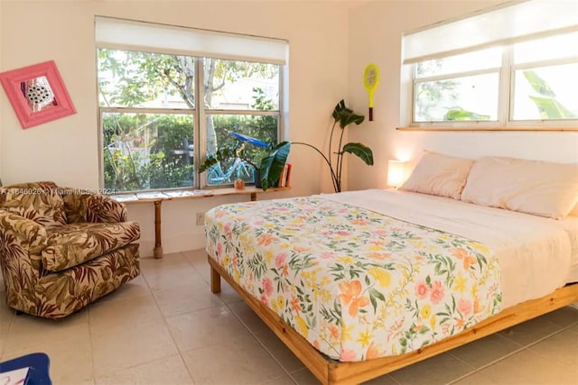 bedroom with light tile patterned floors