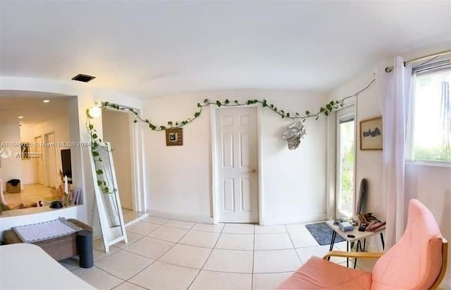 living room with light tile patterned floors