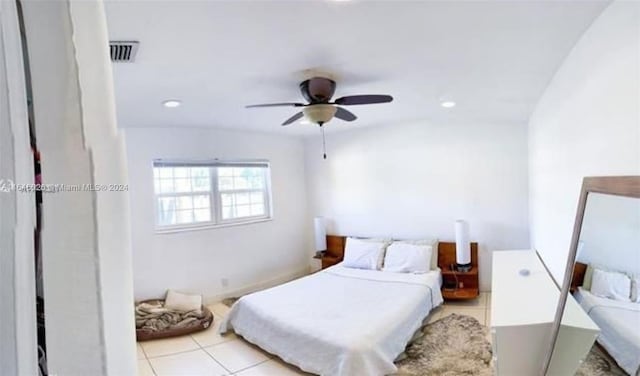 tiled bedroom with ceiling fan