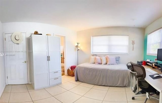 tiled bedroom with connected bathroom