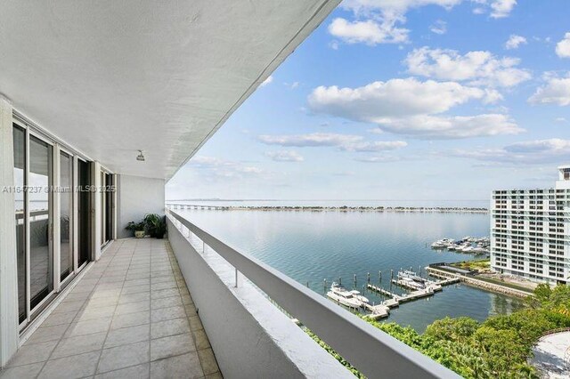 balcony featuring a water view