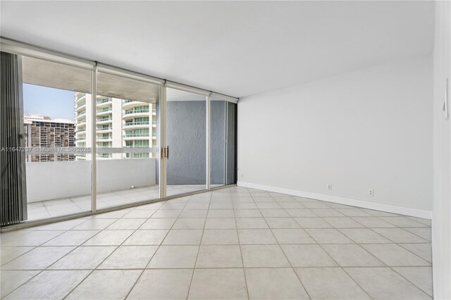 spare room with light tile patterned floors