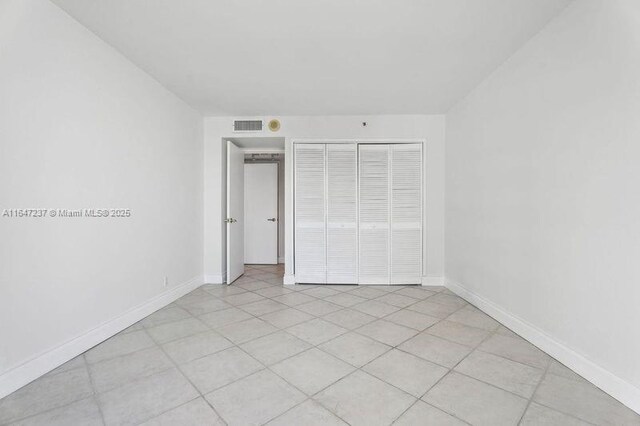 unfurnished bedroom featuring a closet