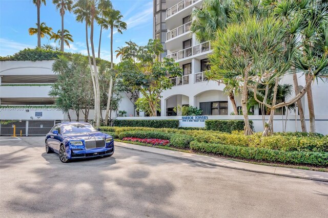 3598 Yacht Club Dr Unit 302, Aventura, FL 33180 - view of building exterior with a parking lot