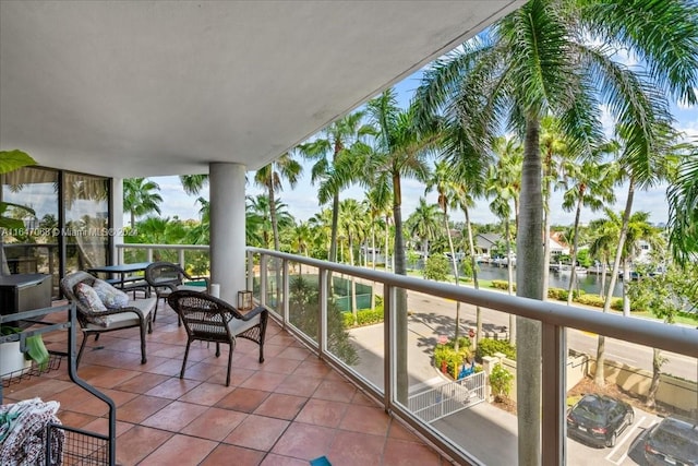 balcony featuring a water view