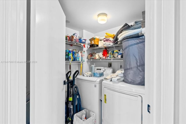 clothes washing area featuring washer and clothes dryer