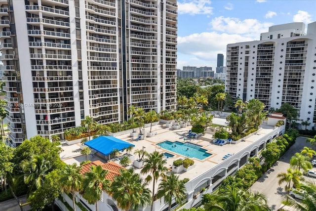 view of property with a city view and a community pool