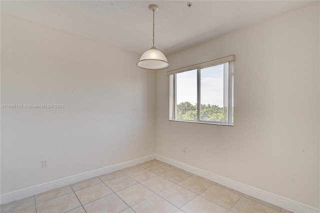 spare room with light tile patterned floors