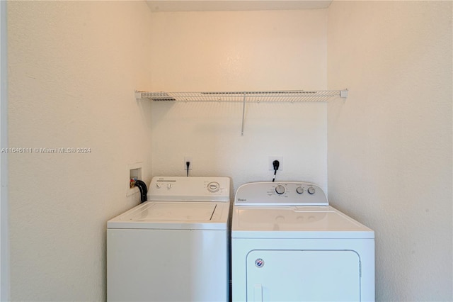 washroom with washer and clothes dryer