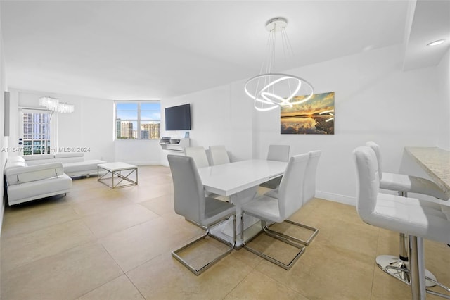 dining space featuring a notable chandelier and light tile patterned floors