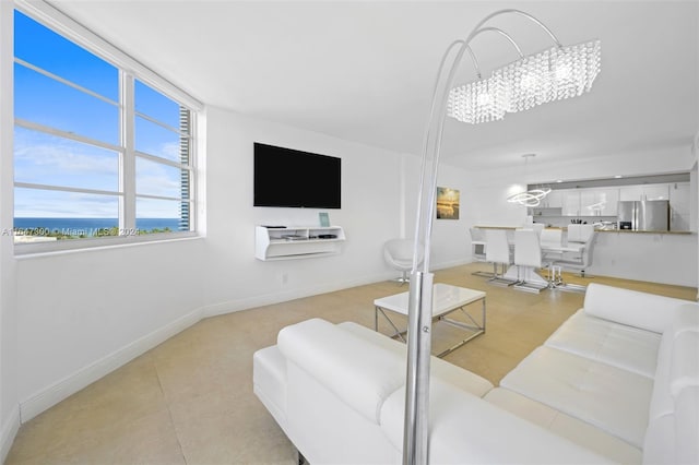 tiled living room featuring a notable chandelier