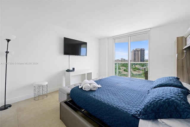 bedroom with light tile patterned floors