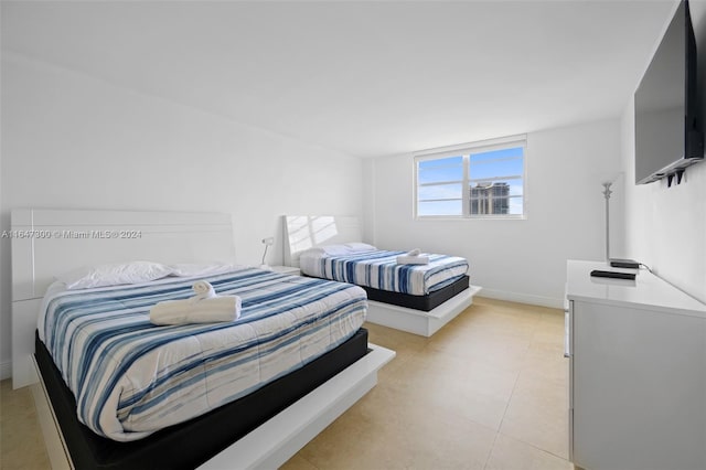 bedroom featuring light tile patterned floors