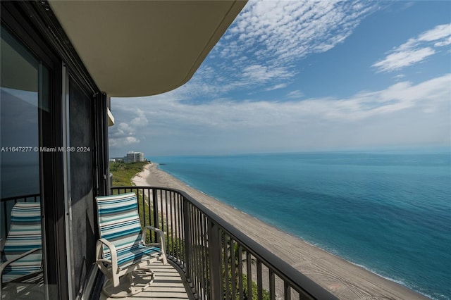 balcony with a beach view and a water view