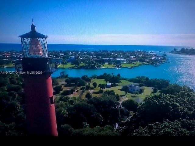 drone / aerial view featuring a water view