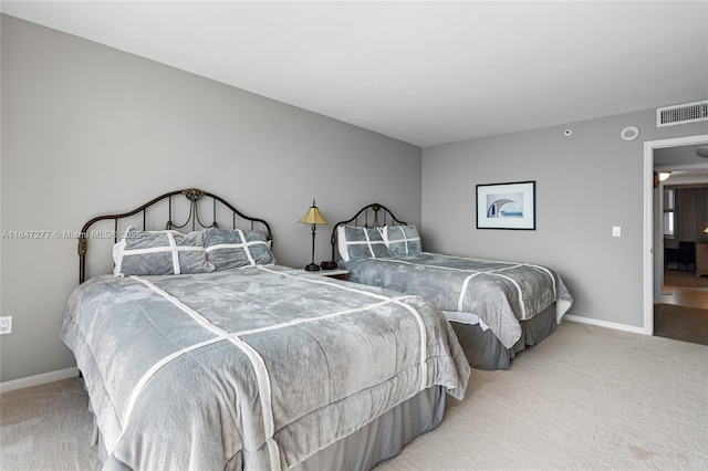 bedroom with baseboards, visible vents, and carpet flooring