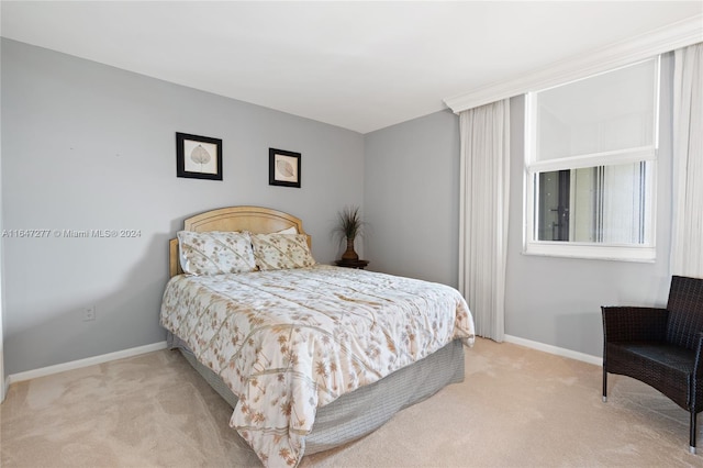 bedroom with light carpet