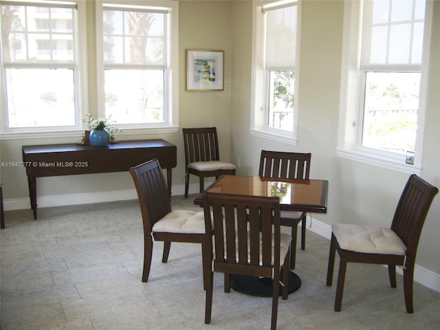 dining area featuring baseboards