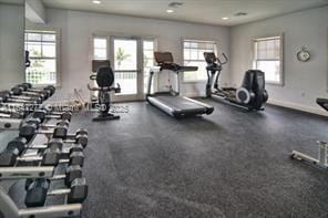 gym featuring recessed lighting and baseboards