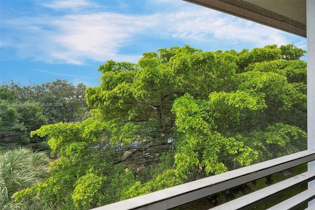 view of yard with a balcony