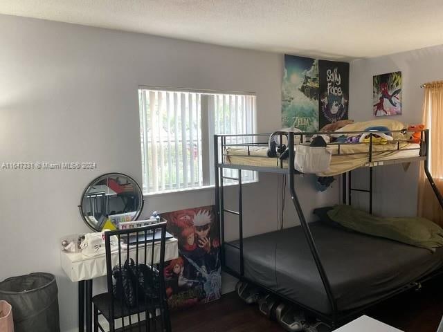 bedroom featuring hardwood / wood-style flooring