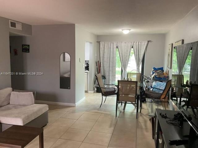 living room with light tile patterned floors