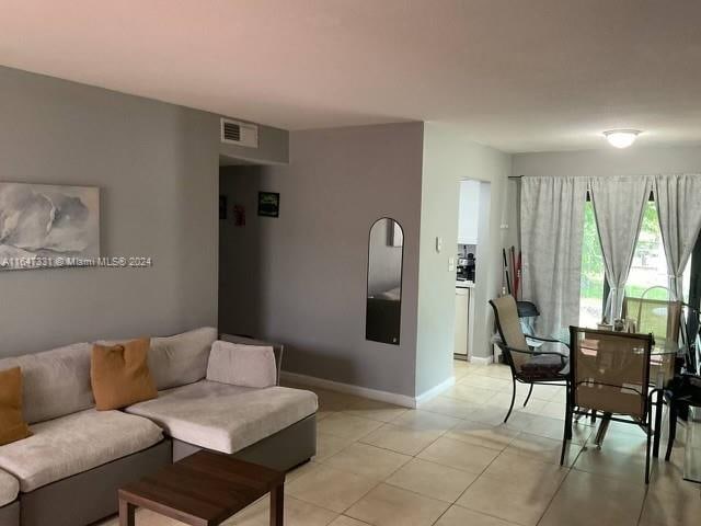 living room featuring light tile patterned floors