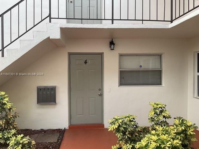 property entrance with a balcony