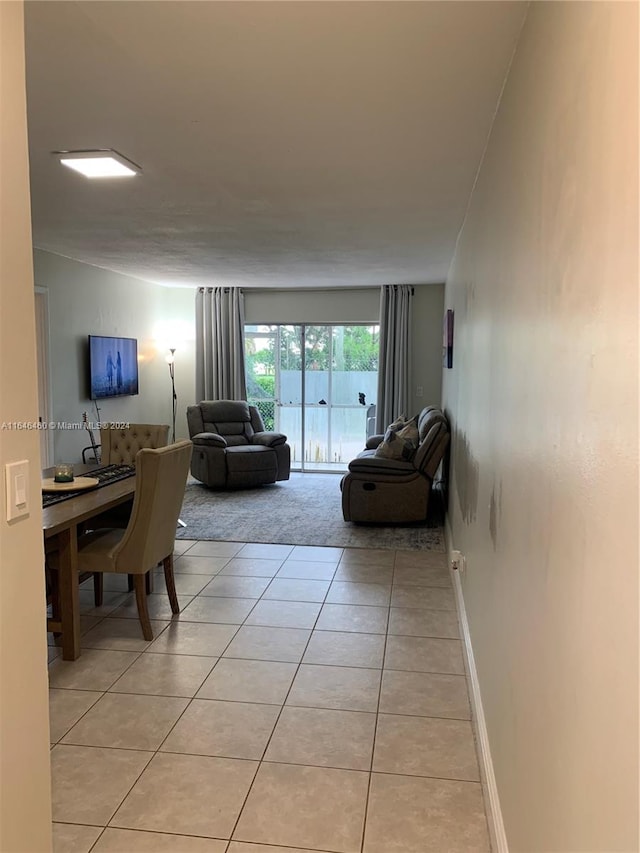 living room with light tile patterned floors