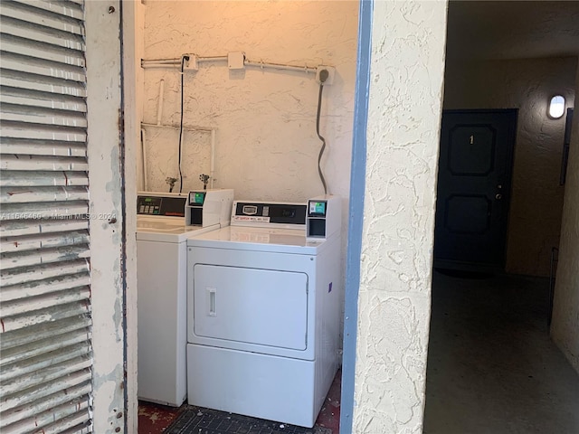 laundry room with washing machine and dryer