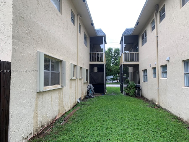 view of yard featuring a balcony