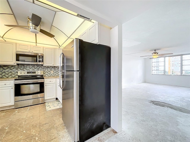 kitchen with appliances with stainless steel finishes, ceiling fan, decorative backsplash, and white cabinets