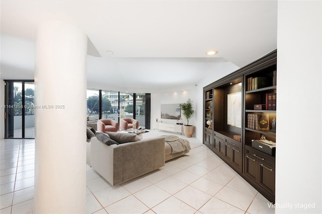 tiled living room with floor to ceiling windows